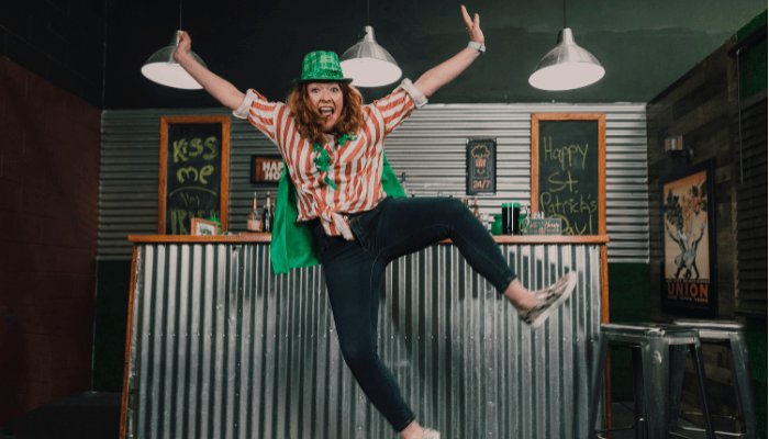Woman jumping with St Patricks costumes