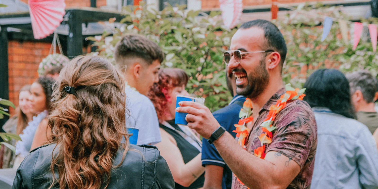 Guests Enjoying the Backyard at Canbe Summer Party - Garden at Gardiner House Hostel in Dublin