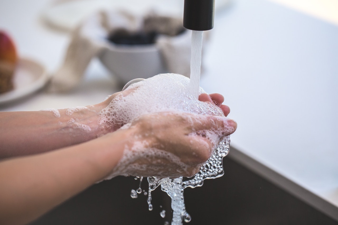 A person washing her hands