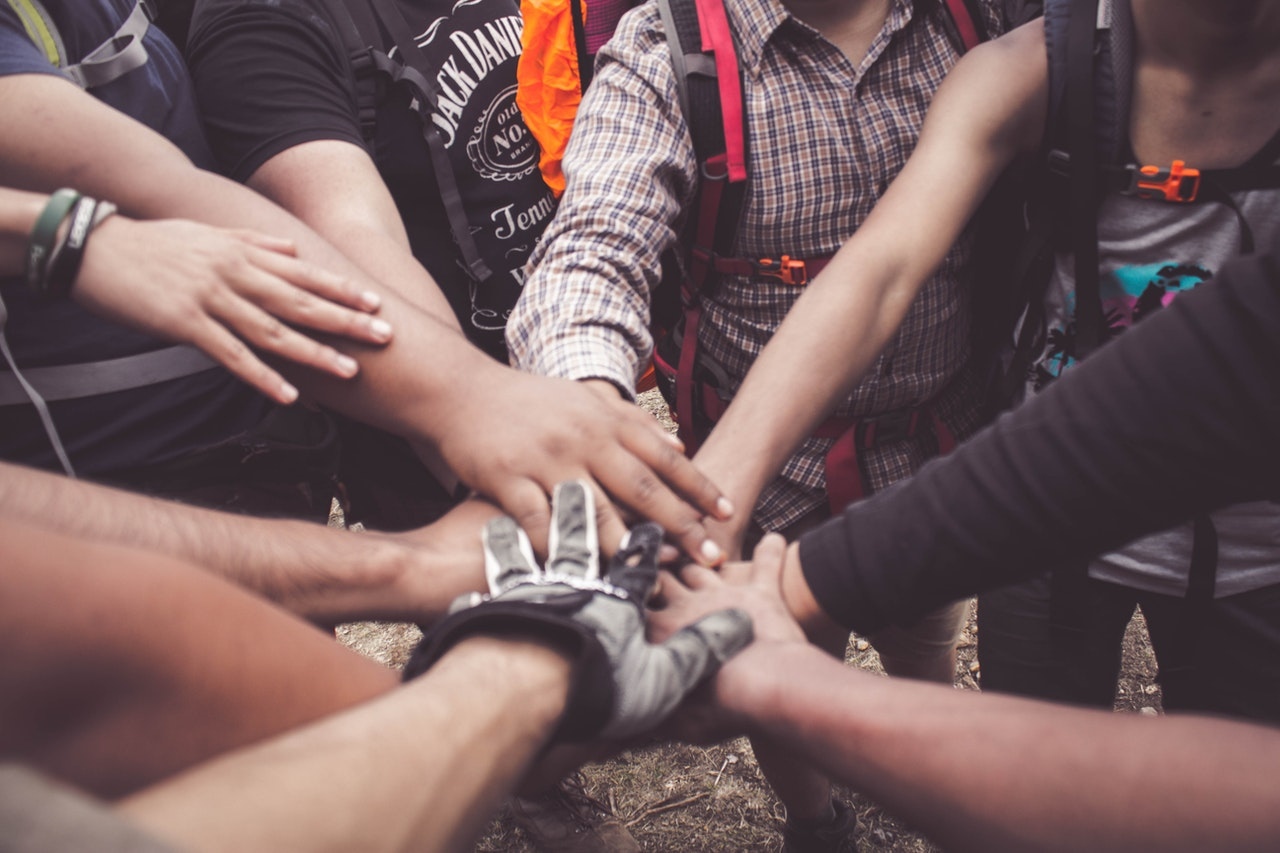 People putting their hands together as a sign of support